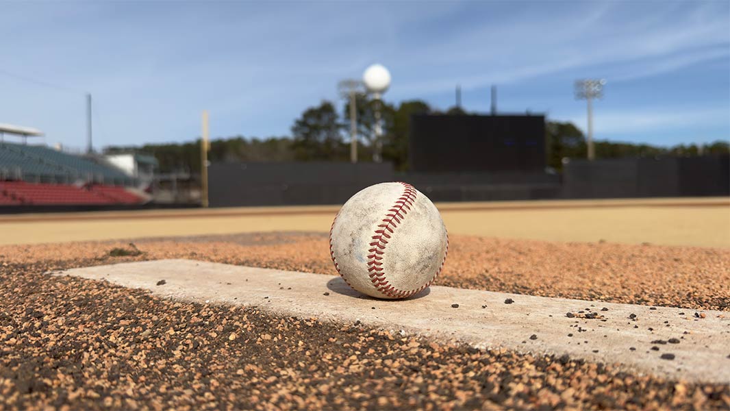 Photo of a baseball on the pitcher's mound